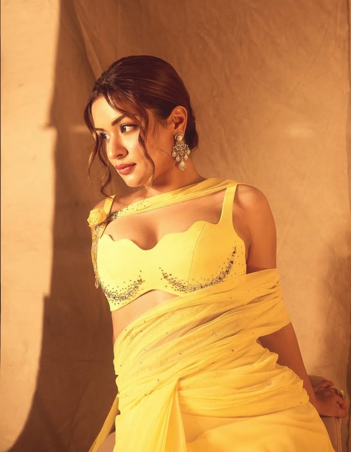 Avneet Kaur shines in a yellow draped gown that blends softness with statement style 996056