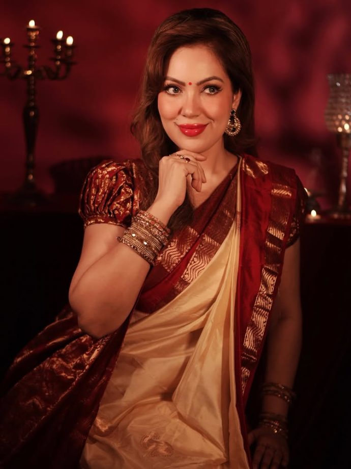 Munmun Dutta brings timeless elegance in a classic red and gold saree look 996083