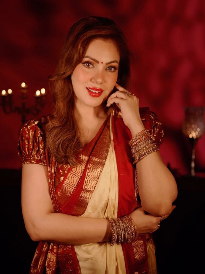 Munmun Dutta brings timeless elegance in a classic red and gold saree look 996084