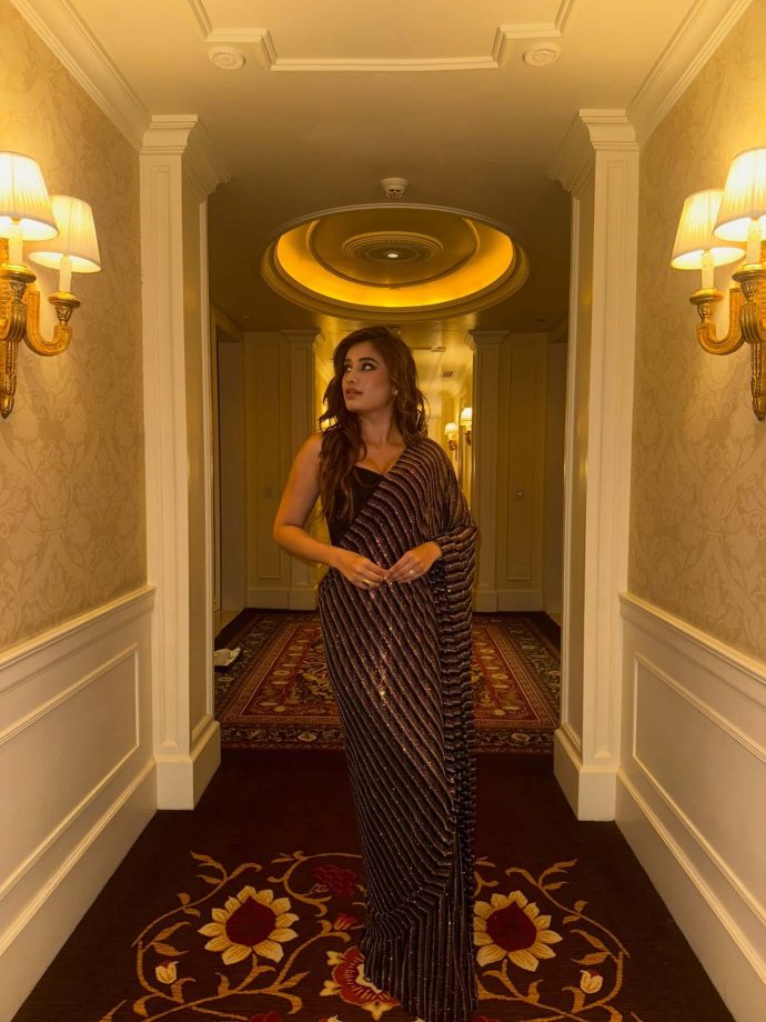 Rasha Thadani Keeps It Glam in a Black Shimmery Saree 996725