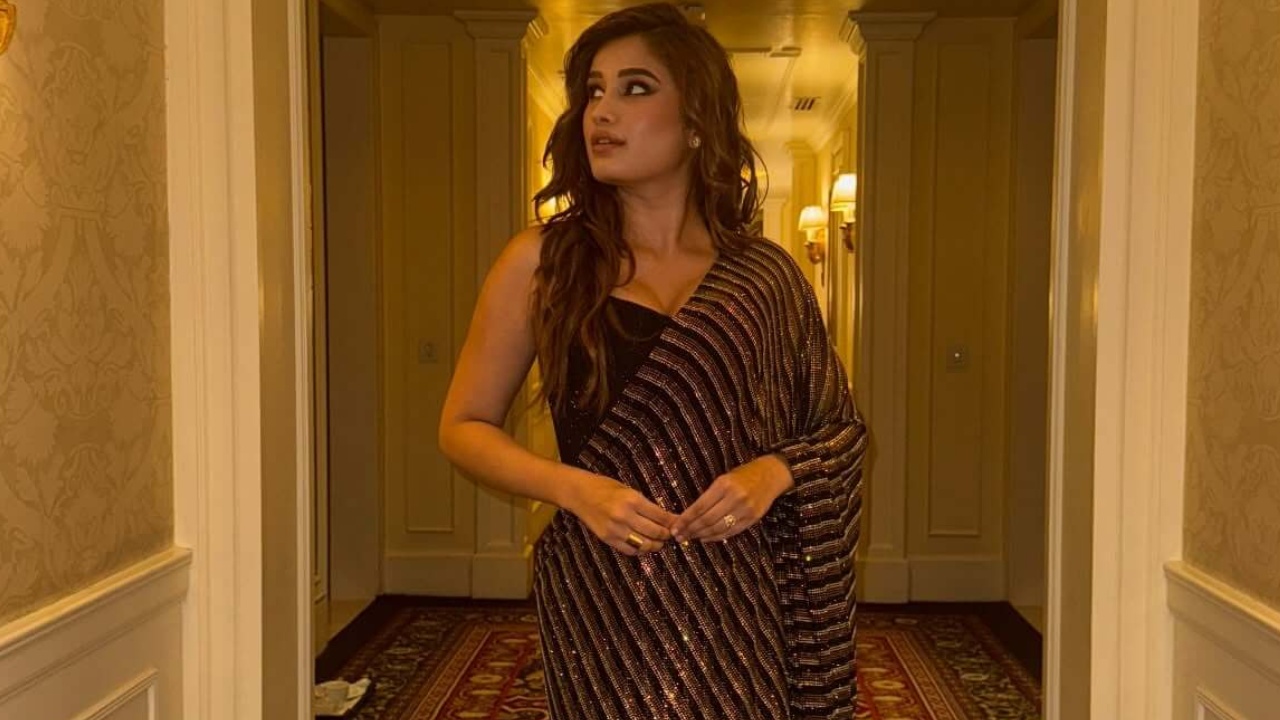 Rasha Thadani Keeps It Glam in a Black Shimmery Saree 996740