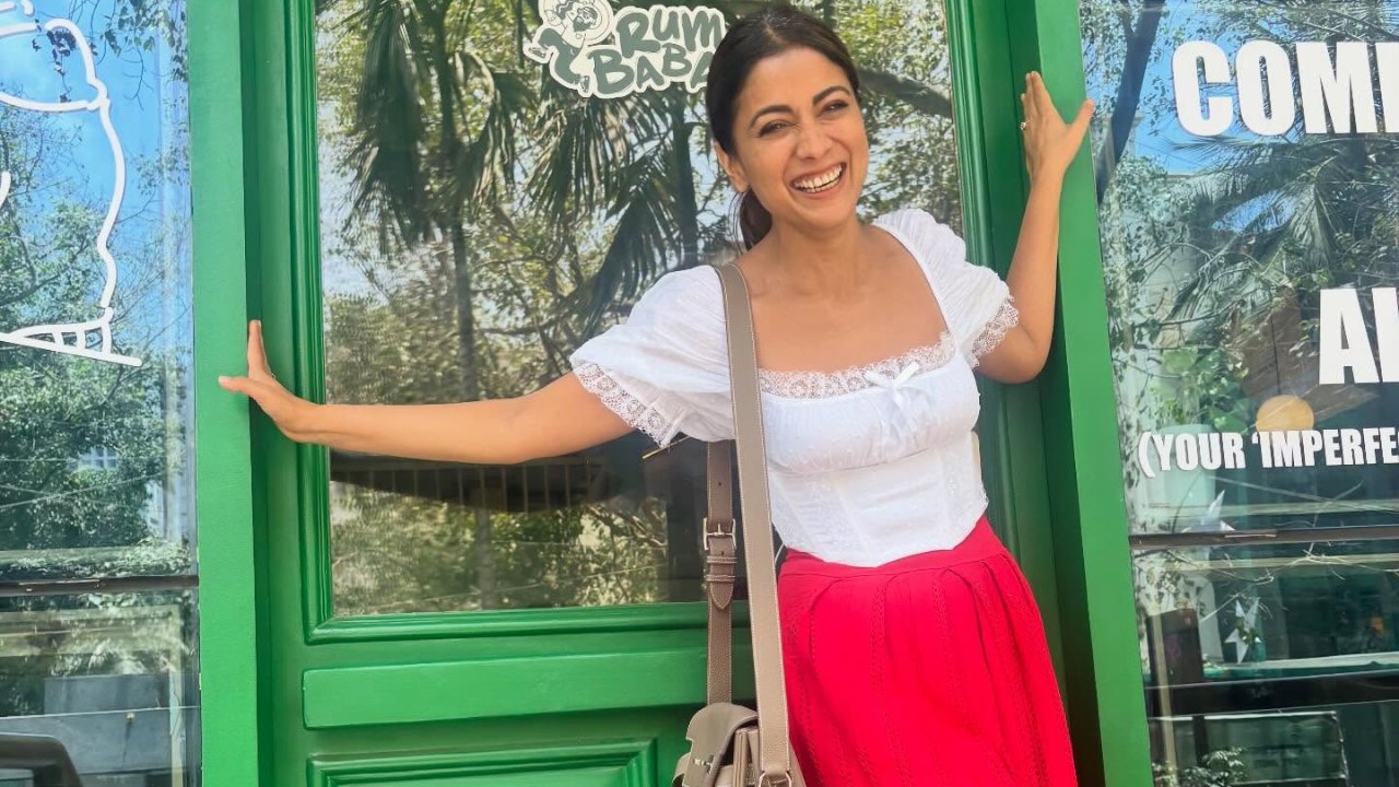 Shriya Saran Stuns in Red Skirt and White Top with Effortless Summer Style 996199