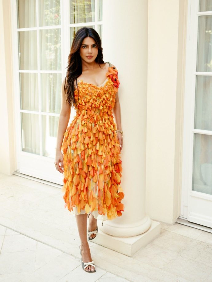 Priyanka Chopra Brings Parisian Glamour to Life in a Striking Orange Fringe Dress 1
