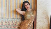 Rasha Thadani Stuns Metallic Gold Saree Glamour