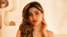 Nikki Tamboli’s Figure-Hugging Olive Green Halter Neck Dress