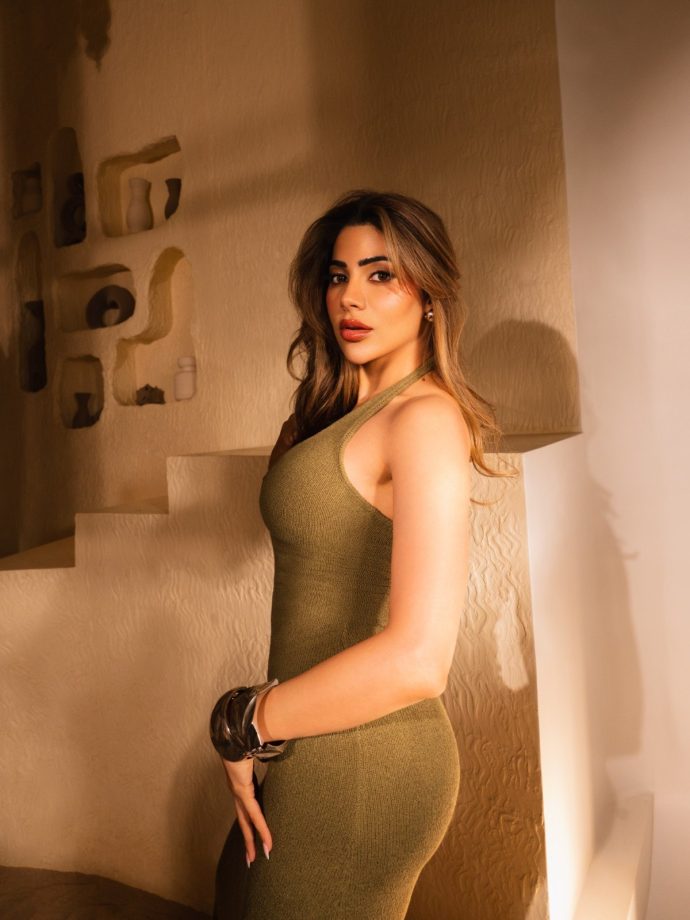 Nikki Tamboli’s Figure-Hugging Olive Green Halter Neck Dress 1