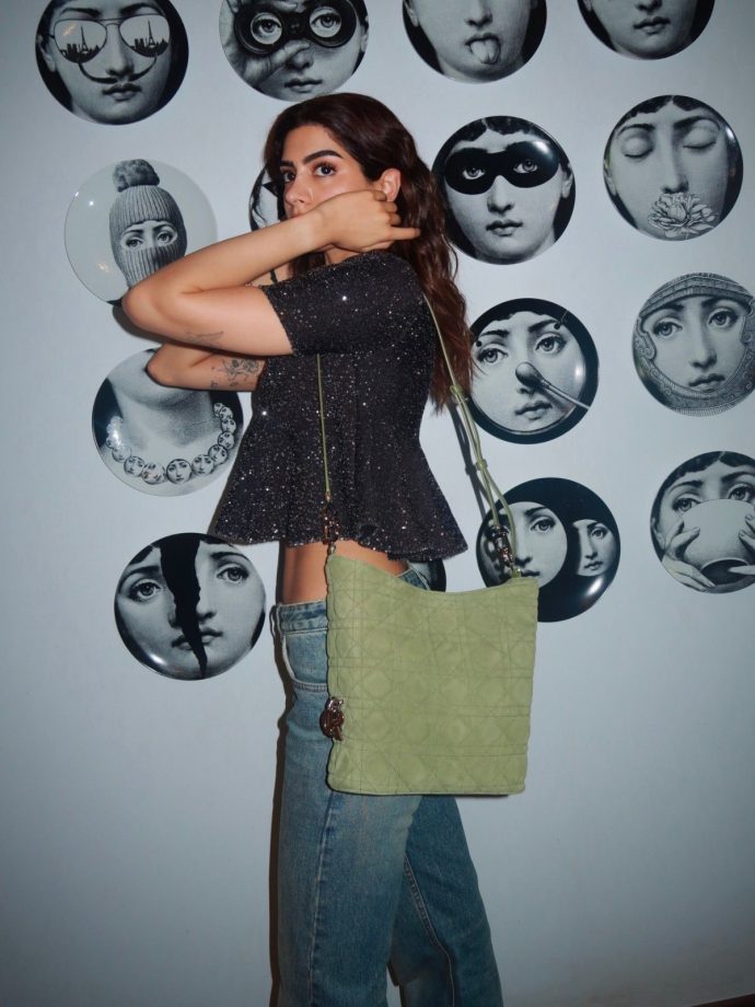 Khushi Kapoor Makes A Chic Statement In A Shimmery Black Crop Top And Blue Denim 1