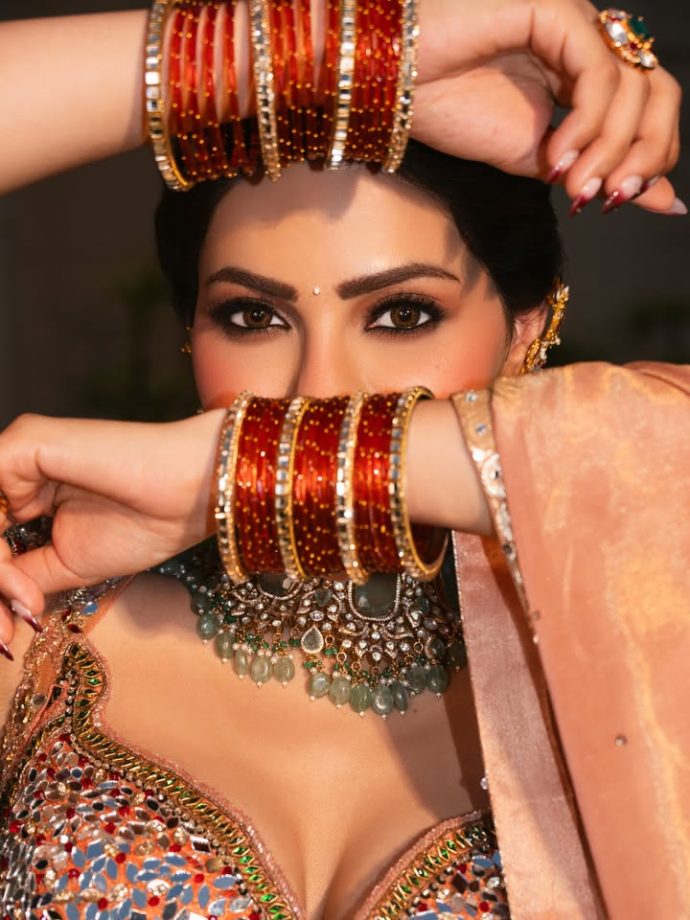 Nikki Tamboli Stuns in a Peach Embroidered Lehenga 1