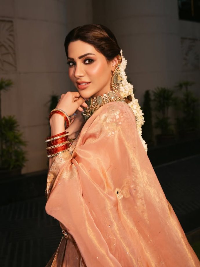 Nikki Tamboli Stuns in a Peach Embroidered Lehenga 1