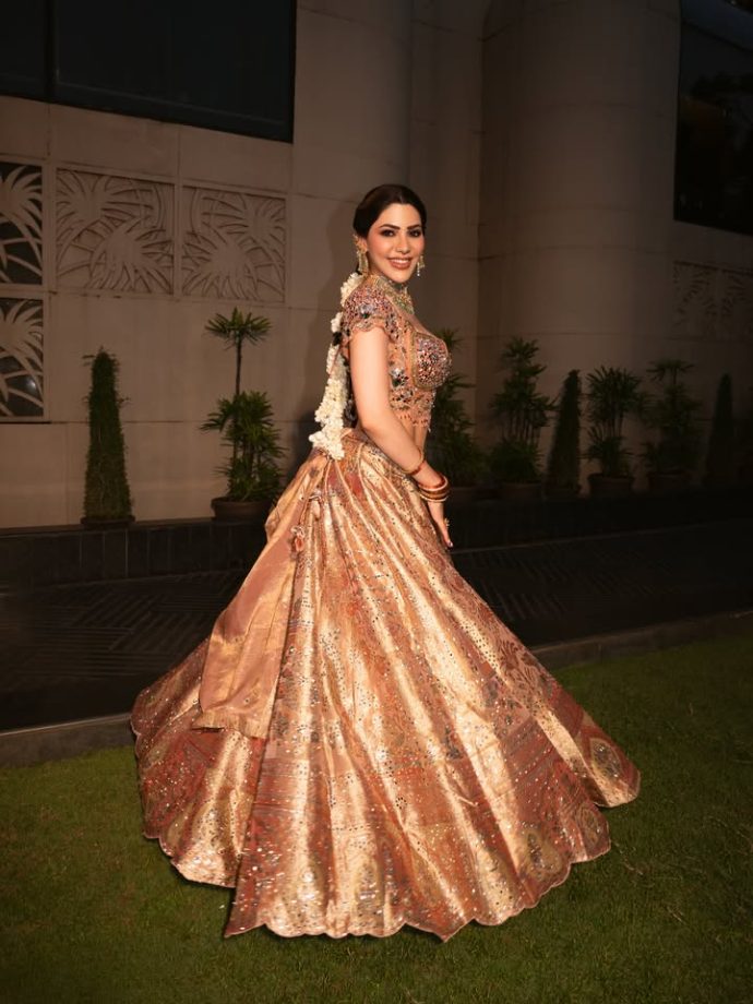 Nikki Tamboli Stuns in a Peach Embroidered Lehenga 1