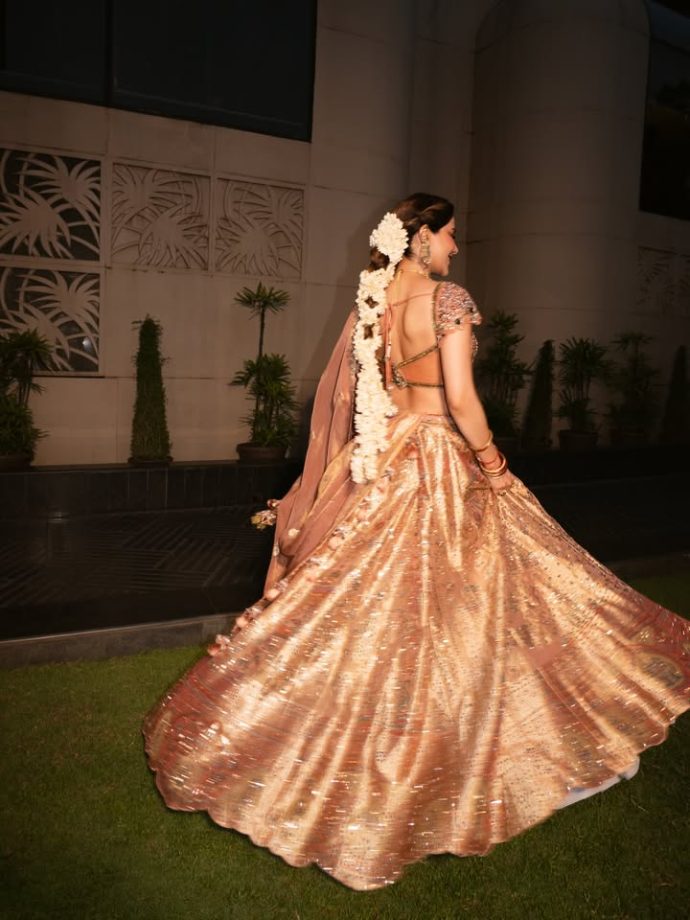 Nikki Tamboli Stuns in a Peach Embroidered Lehenga 1