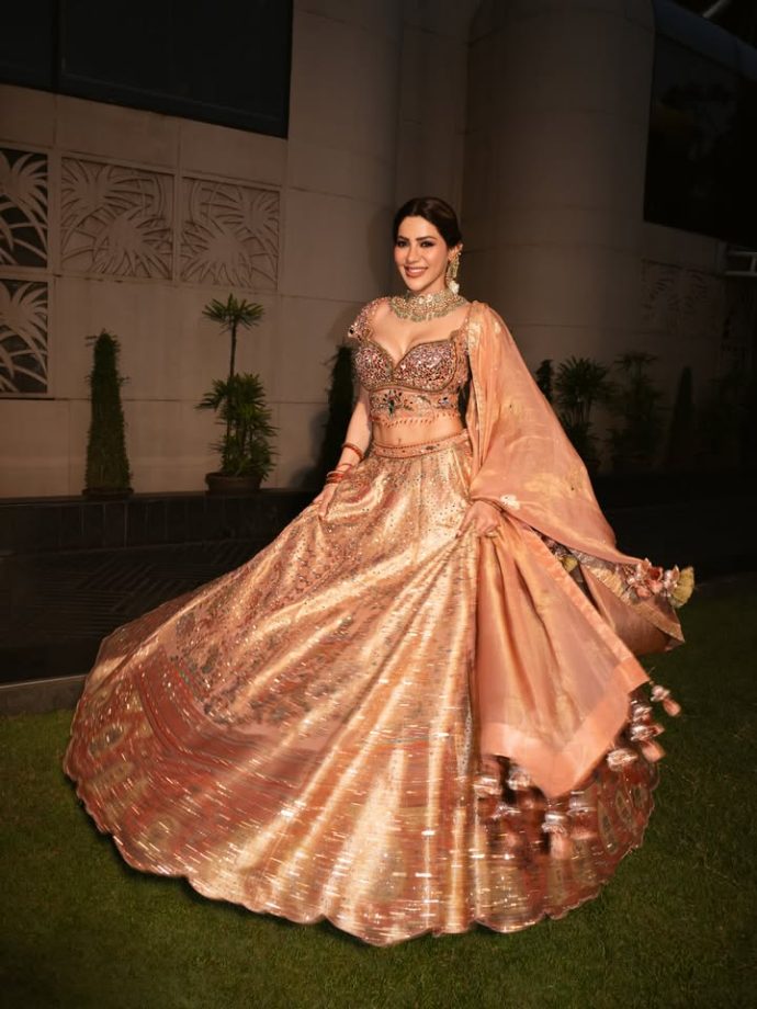 Nikki Tamboli Stuns in a Peach Embroidered Lehenga 1