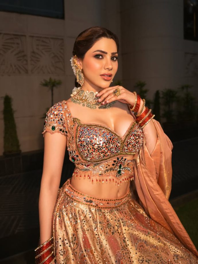 Nikki Tamboli Stuns in a Peach Embroidered Lehenga 1